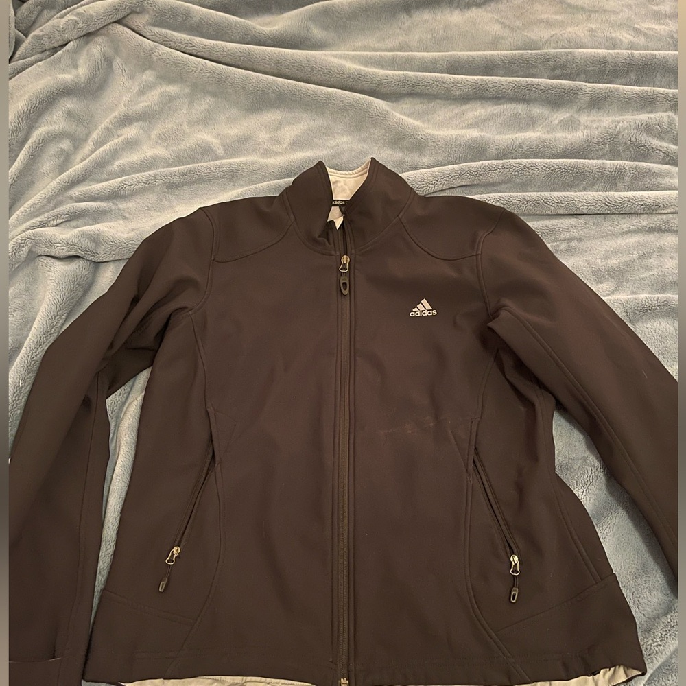 Black Adidas outdoor jacket. Weather wicking material. Thermal but lightweight